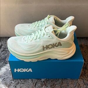 Hoka Clifton 10 running shoes. Womens US size 7. Lt. Green. New in box.